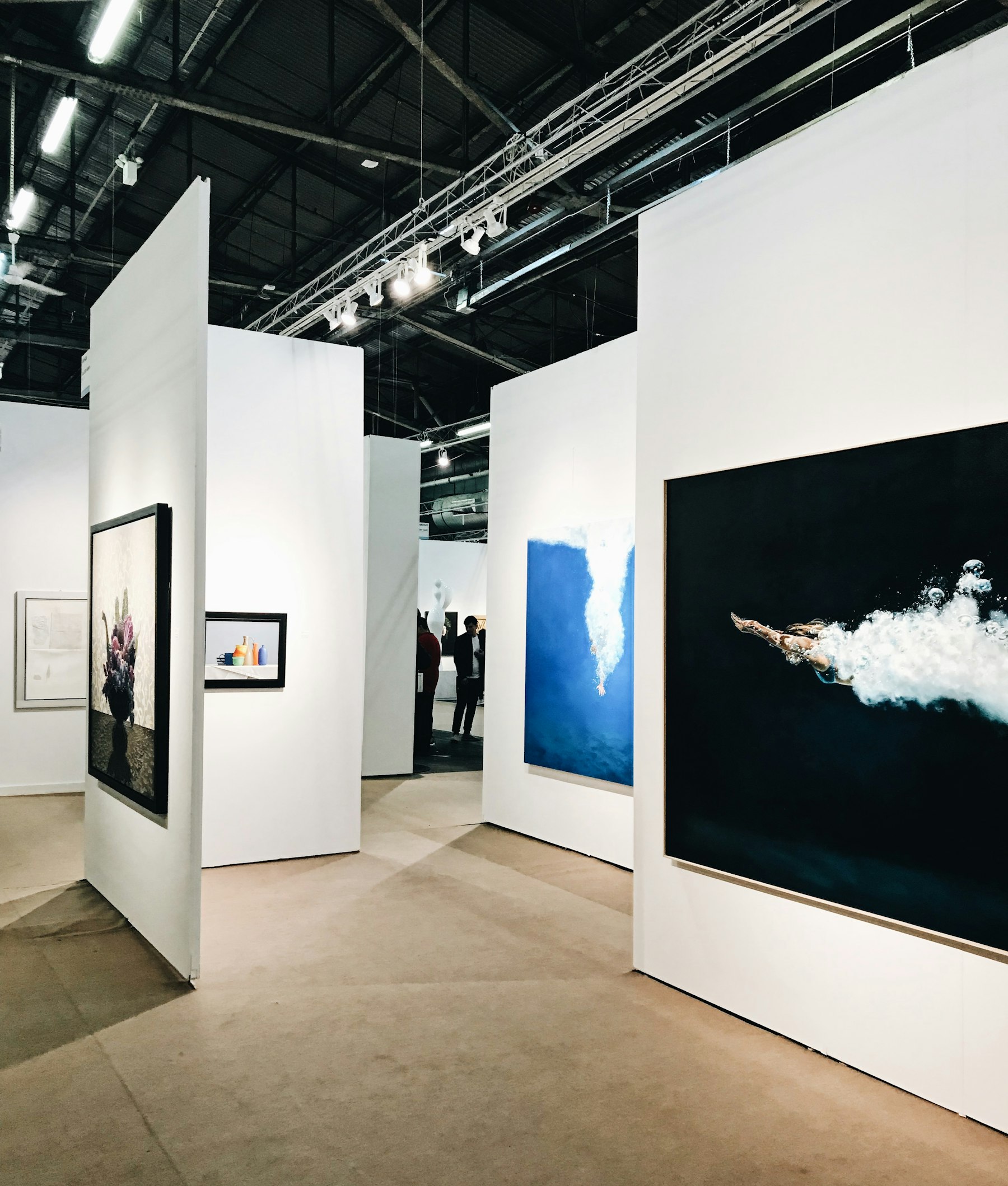 A bright gallery interior hung with contemporary work.