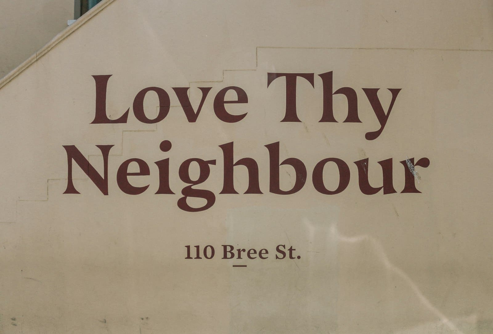 A Love Thy Neighbour wall on Bree Street, Cape Town.